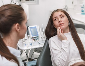 woman experiencing dental emergency in Cumming
