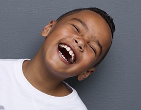 Little boy with healthy smile laughing