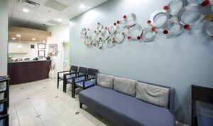 reception and front desk area with seating and blue walls